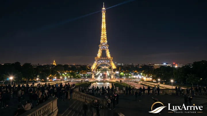 The Eiffel Tower illuminated and sparkling at night viewed from Trocadéro.