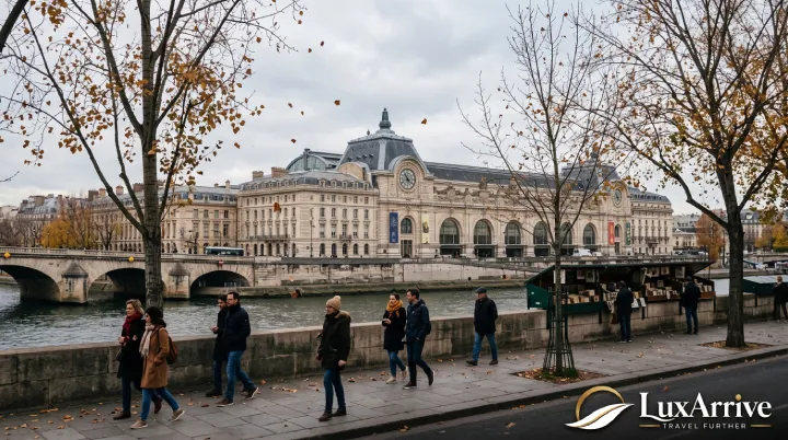 The historic facade of Musée d'Orsay along the Left Bank of the River Seine on an overcast afternoon.